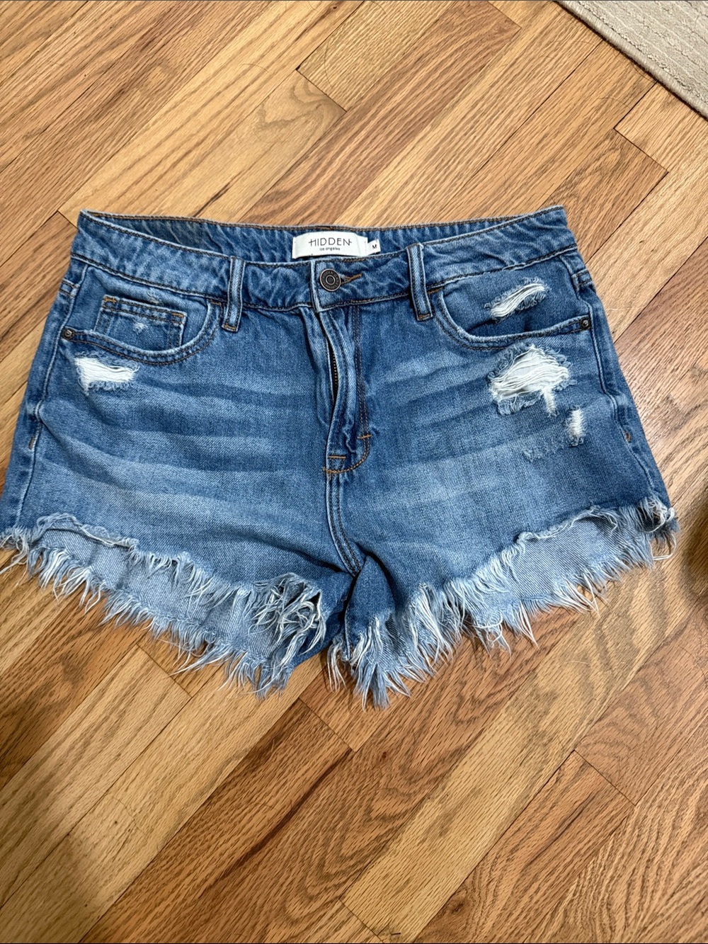 Hidden High-Rise Distressed Denim Shorts in Blue